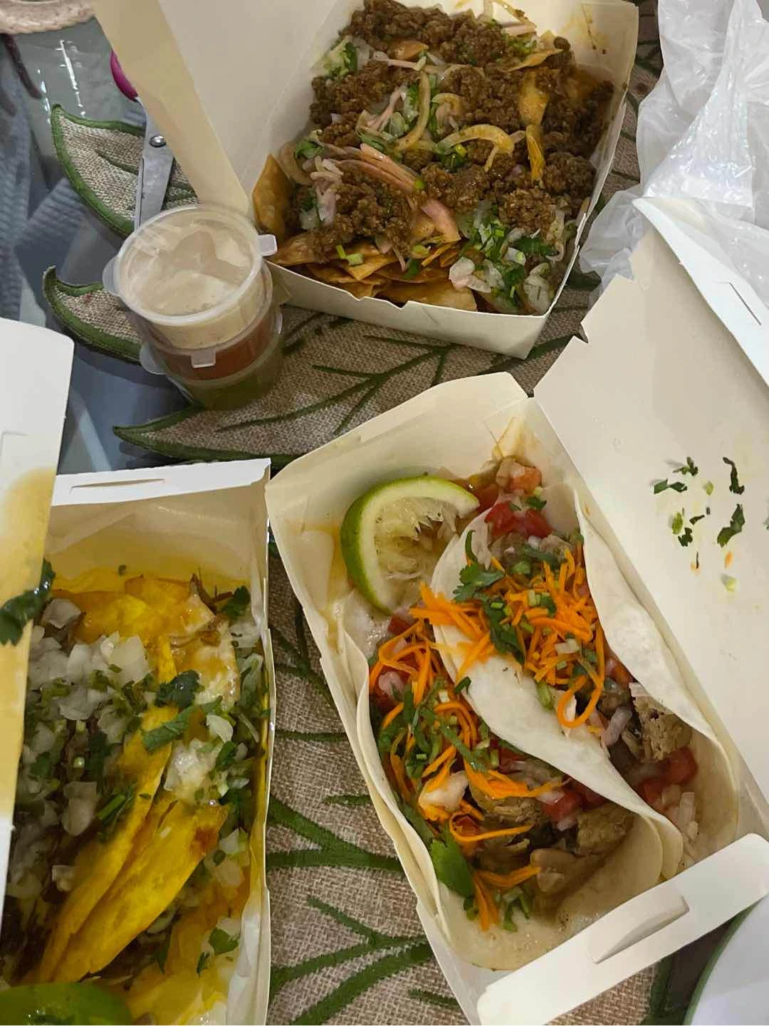 Pork carnitas soft tacos, tortilla chips, quesabirria tacos of El Poco Cantina