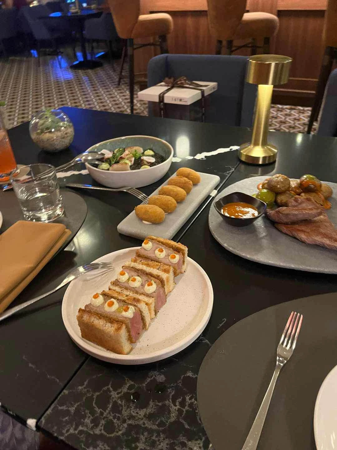 Croquetas, Sando de Solomillo, Arroz Negro and Secreto Iberico