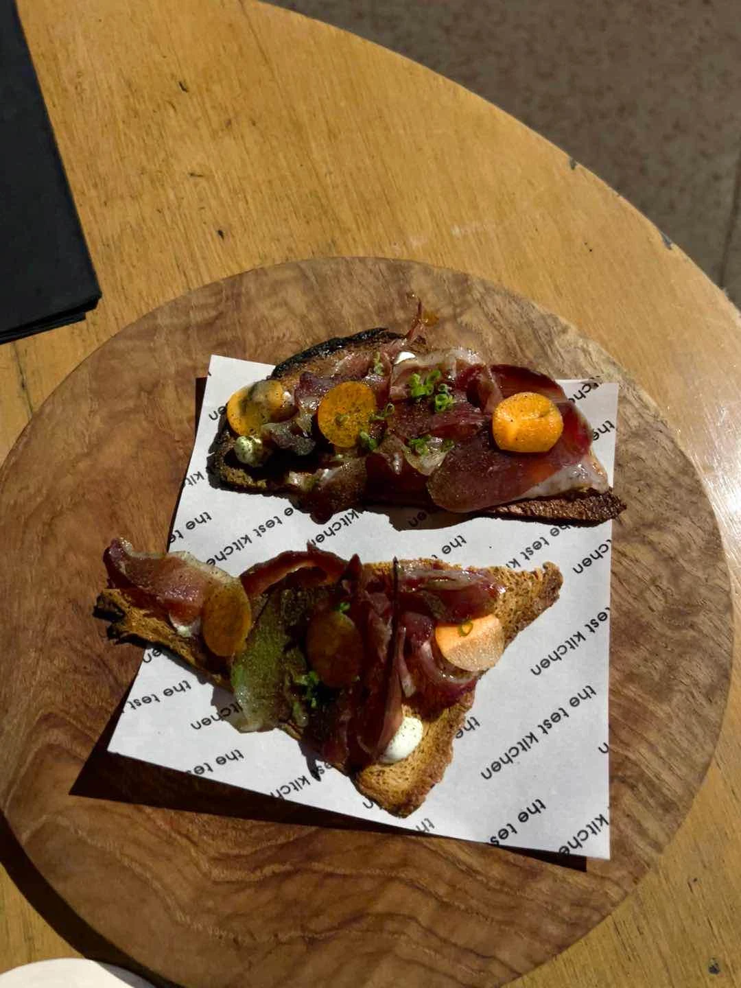 duck prosciutto on toast of The Test Kitchen by Josh Boutwood