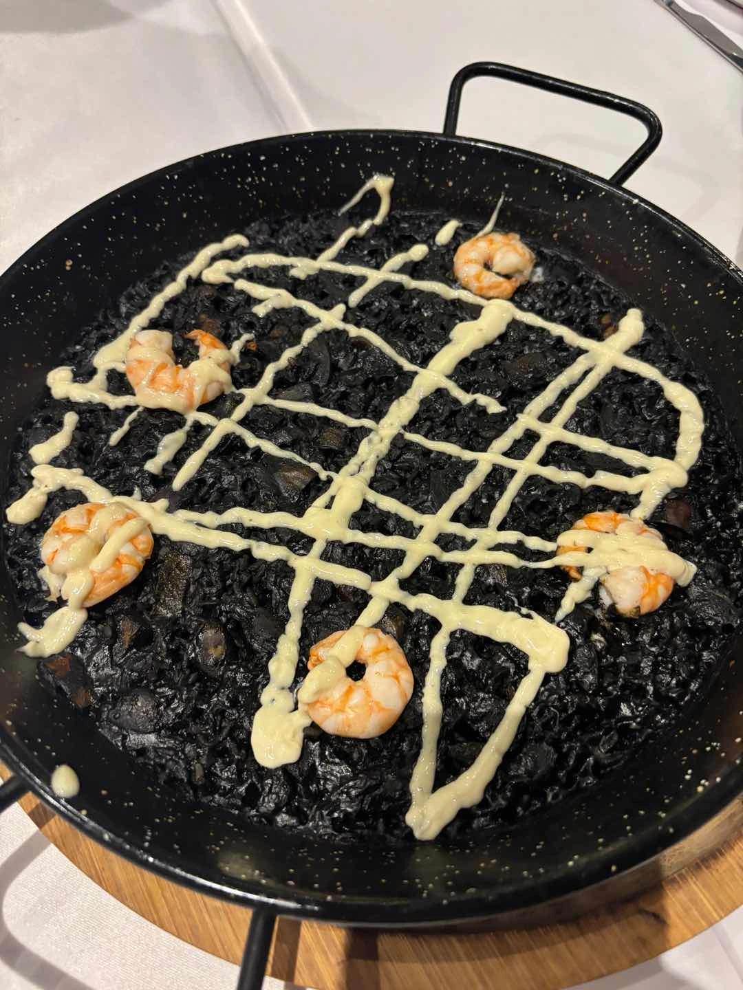 paella negra (squid ink paella with fish octopus & baby squid)