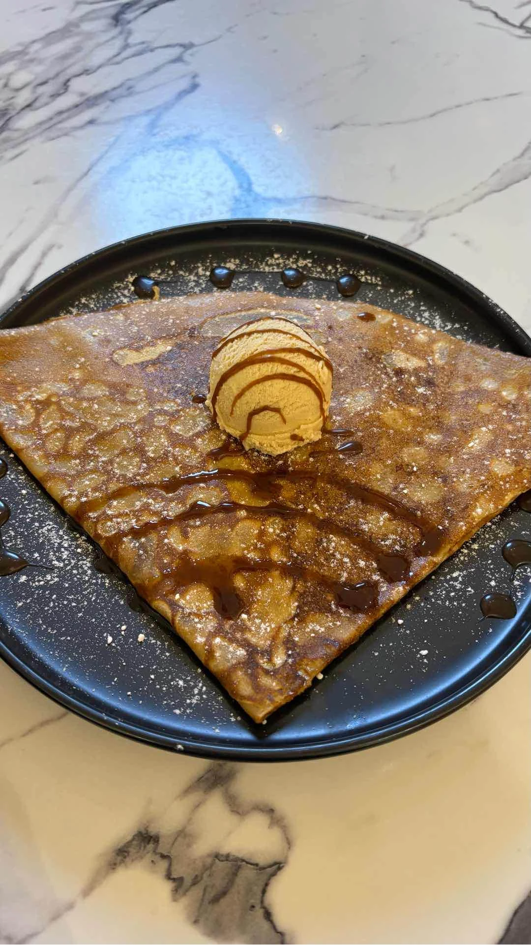 Dessert Crepe - with chocolate, caramel, banana topped with banana gelato of Crêpe Glazik