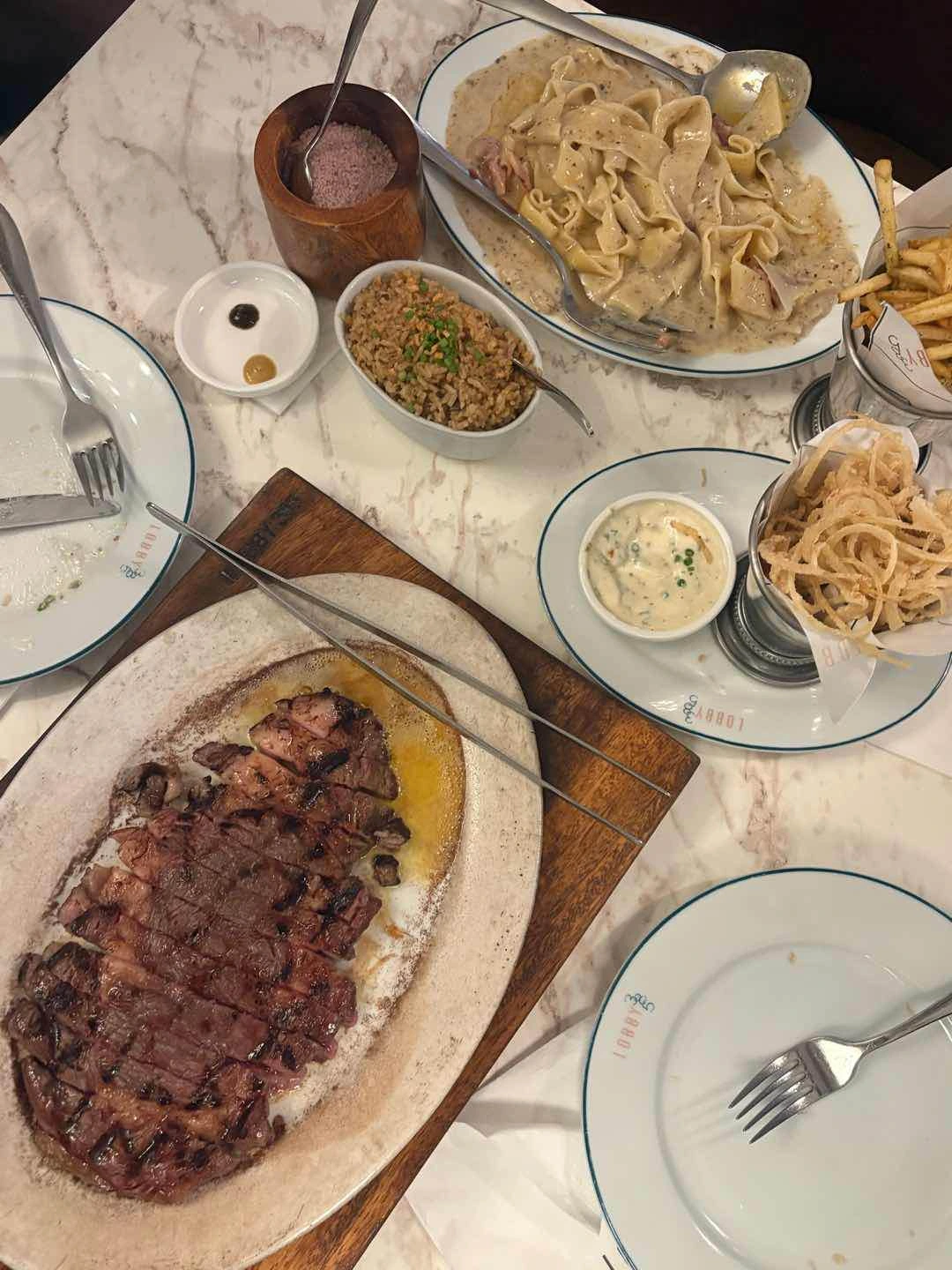 ribeye, truffbonara, crispy onion hay