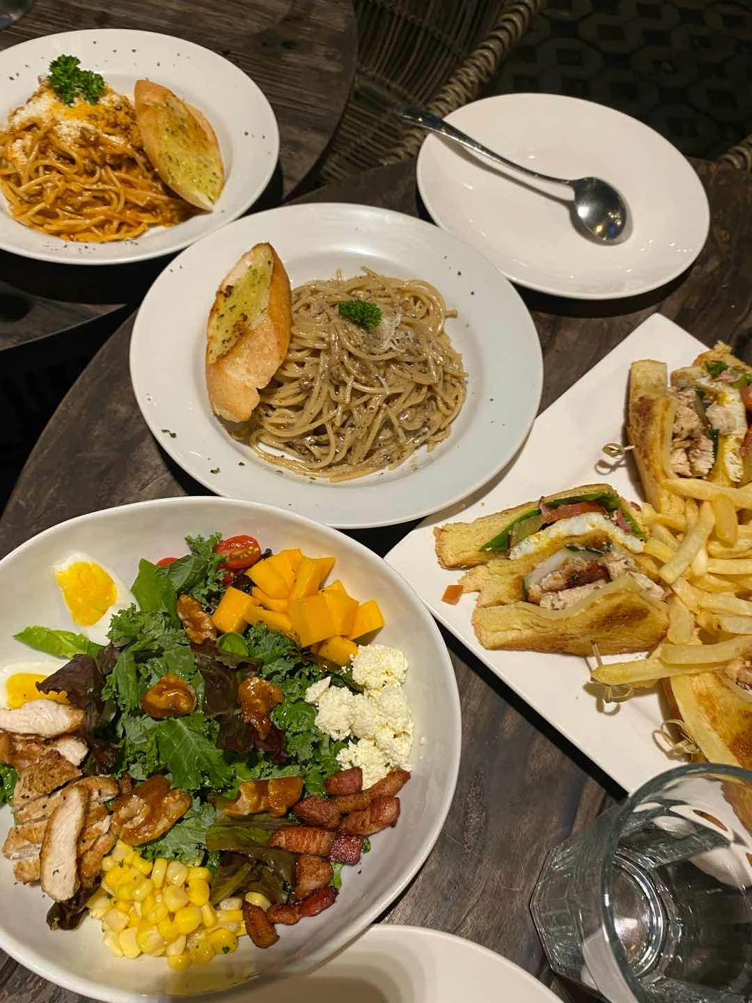 chopped salad, shrimp pomodoro, bolognese, clubhouse sandwich