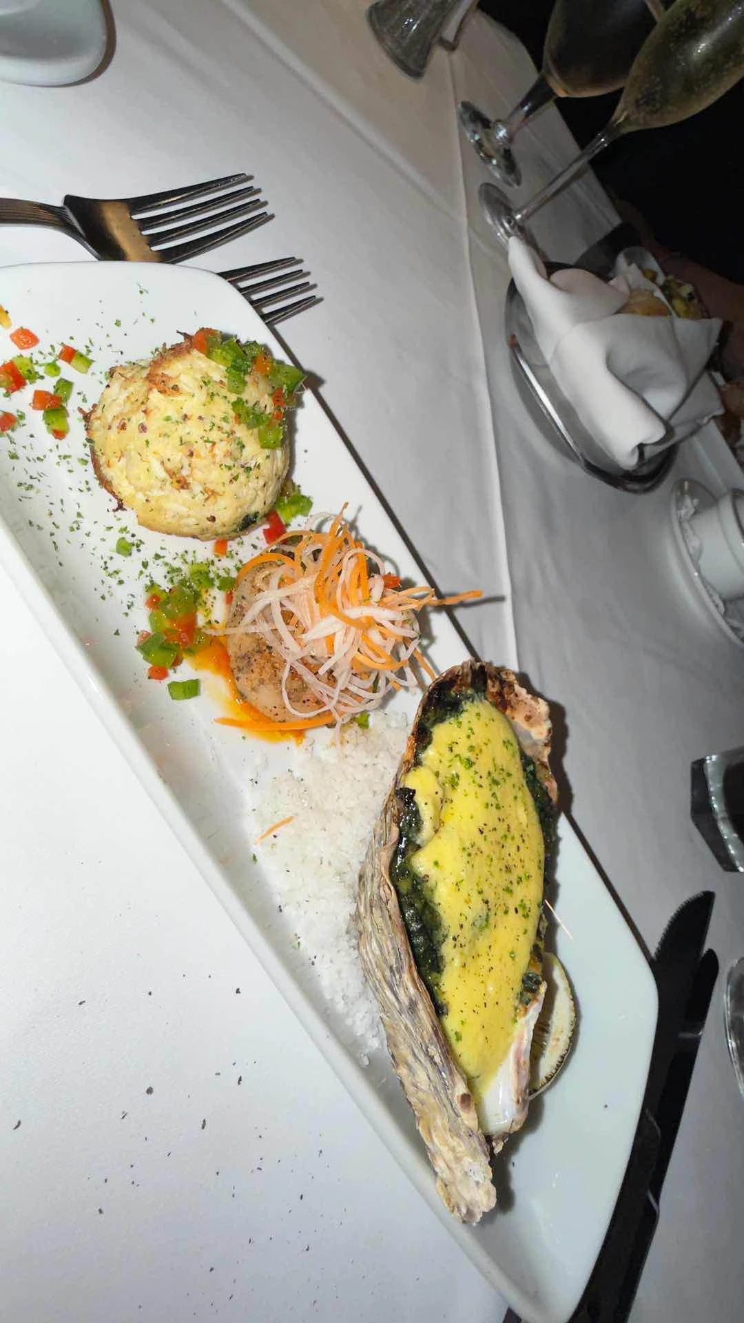 seafood trio (blue crab cake, jumbo scallop, oyster rockefeller)