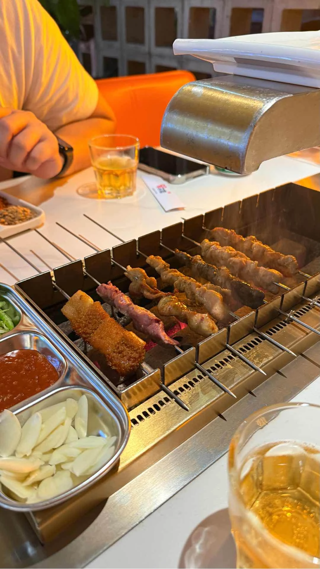 A mix of pork, chicken, and beef skewers