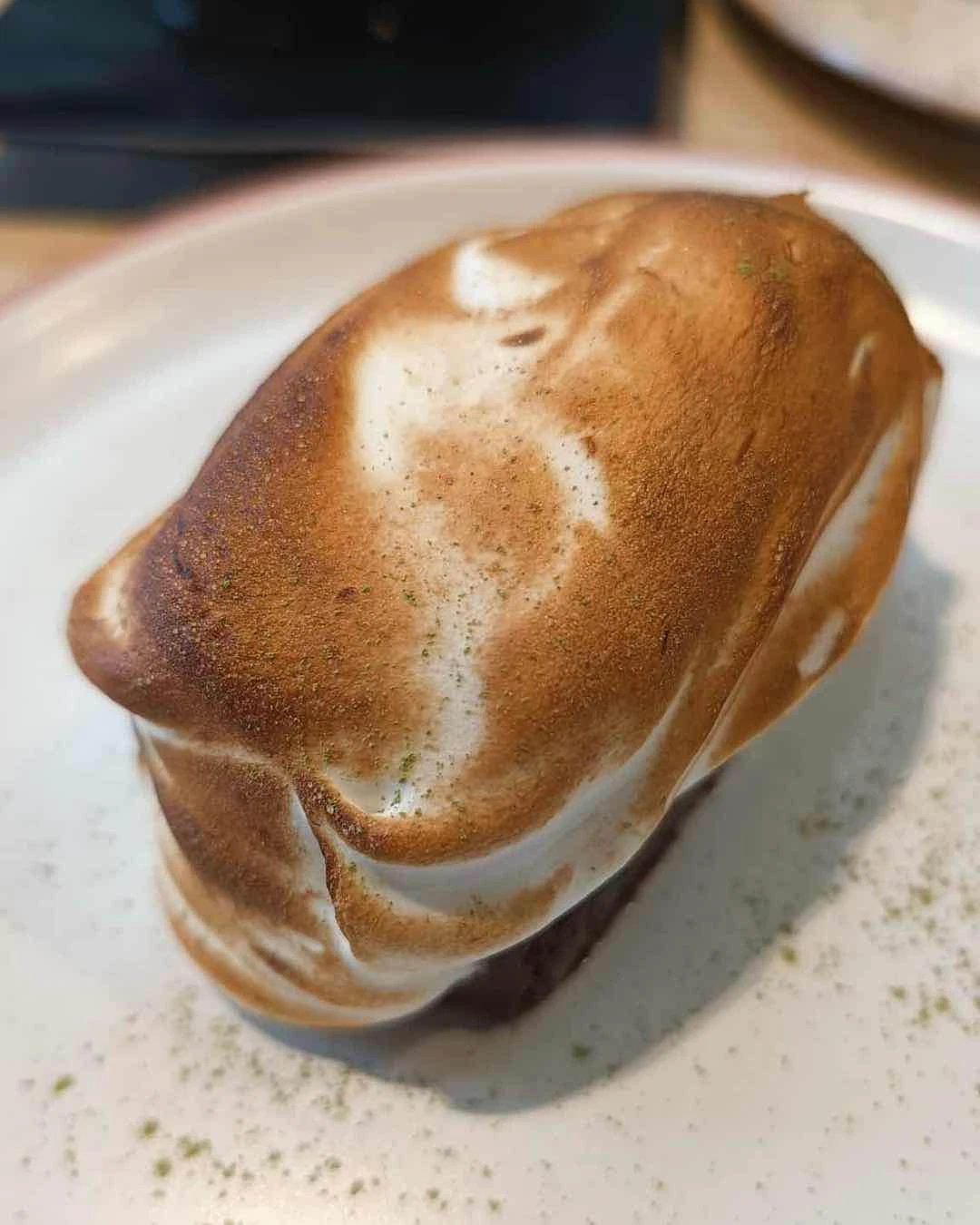 Sensei Chocolate Cake with mango-yuzu curd, matcha, torched meringue