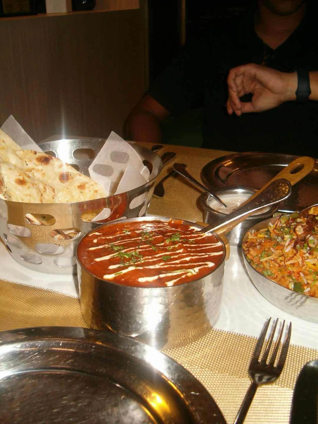 butter masala, veggie biryani, garlic naan, paratha 