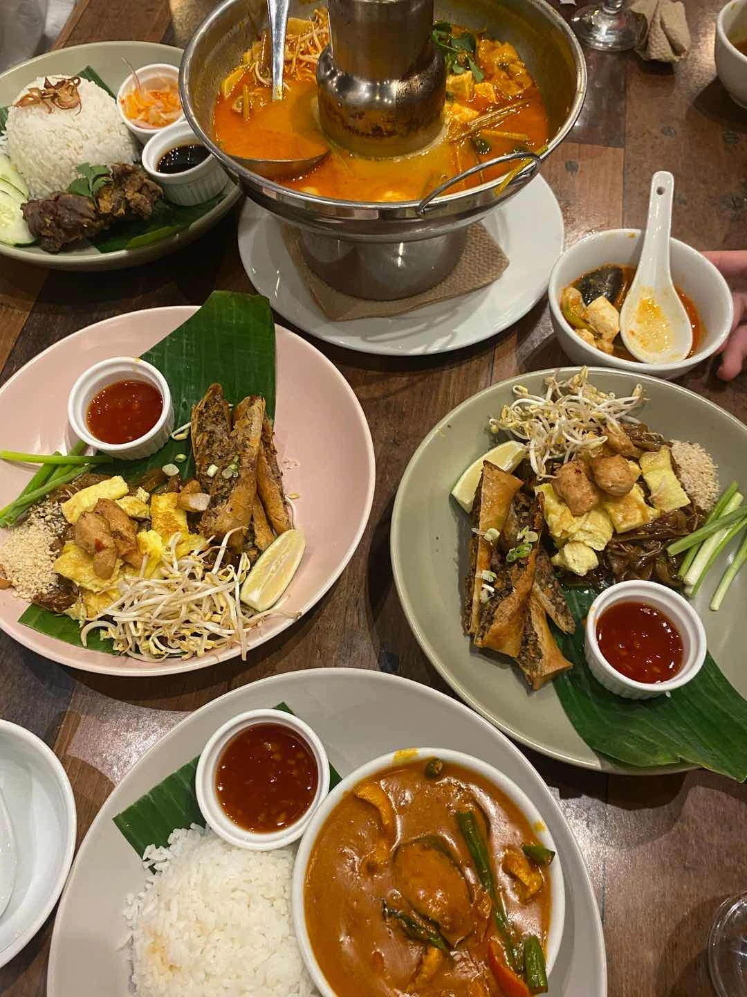 Tom yum, pad thai, and red chicken curry
