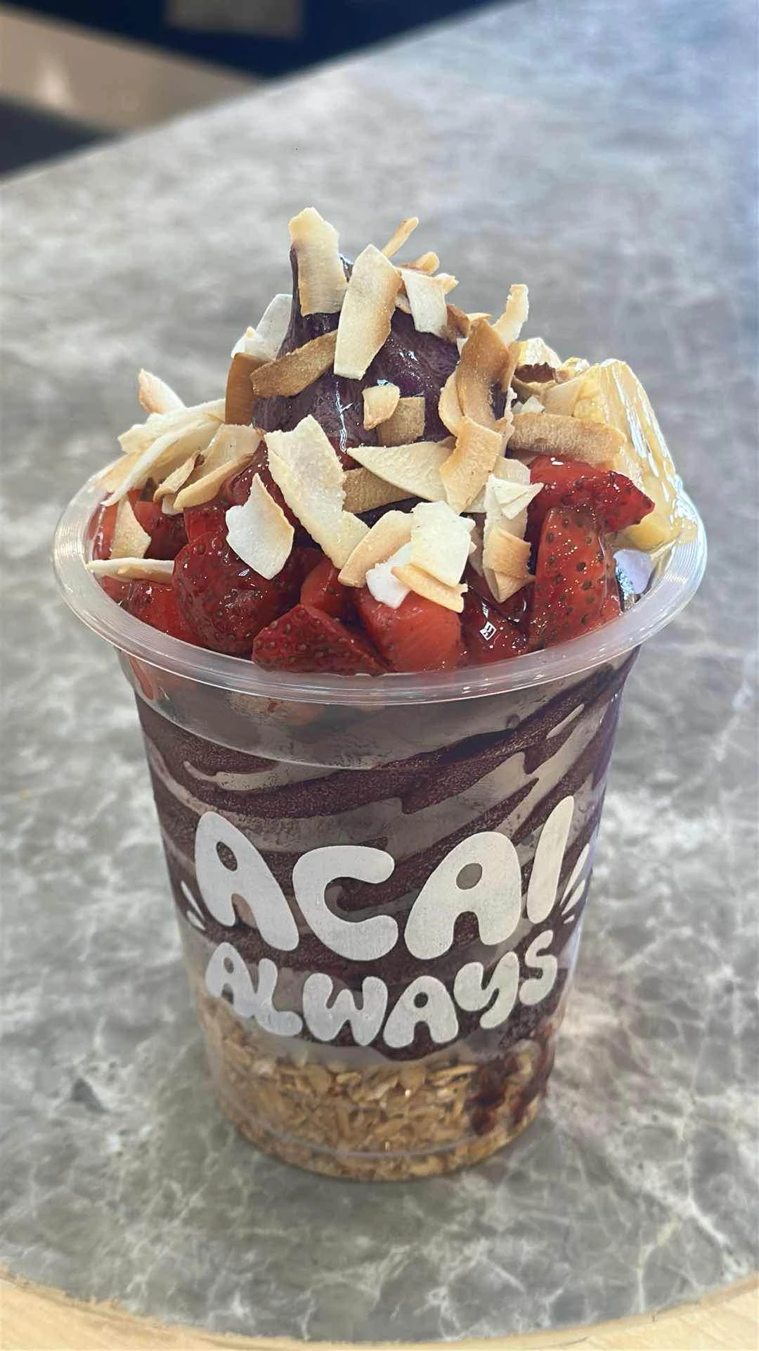 medium acai soft serve with granola, strawberries, bananas, dried coconut & honey