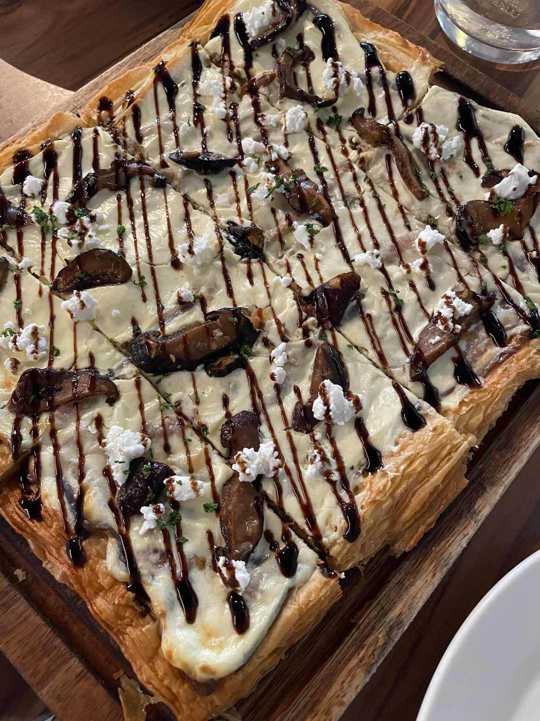 Shiitake, goat cheese, balsamic glaze puff pizza