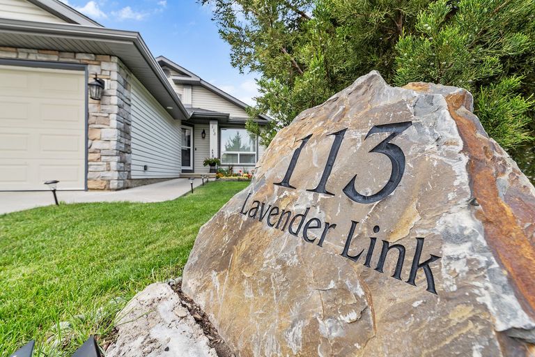 Photo of 2800 square foot bungalow with walkout basement backing into a park. Property Image
