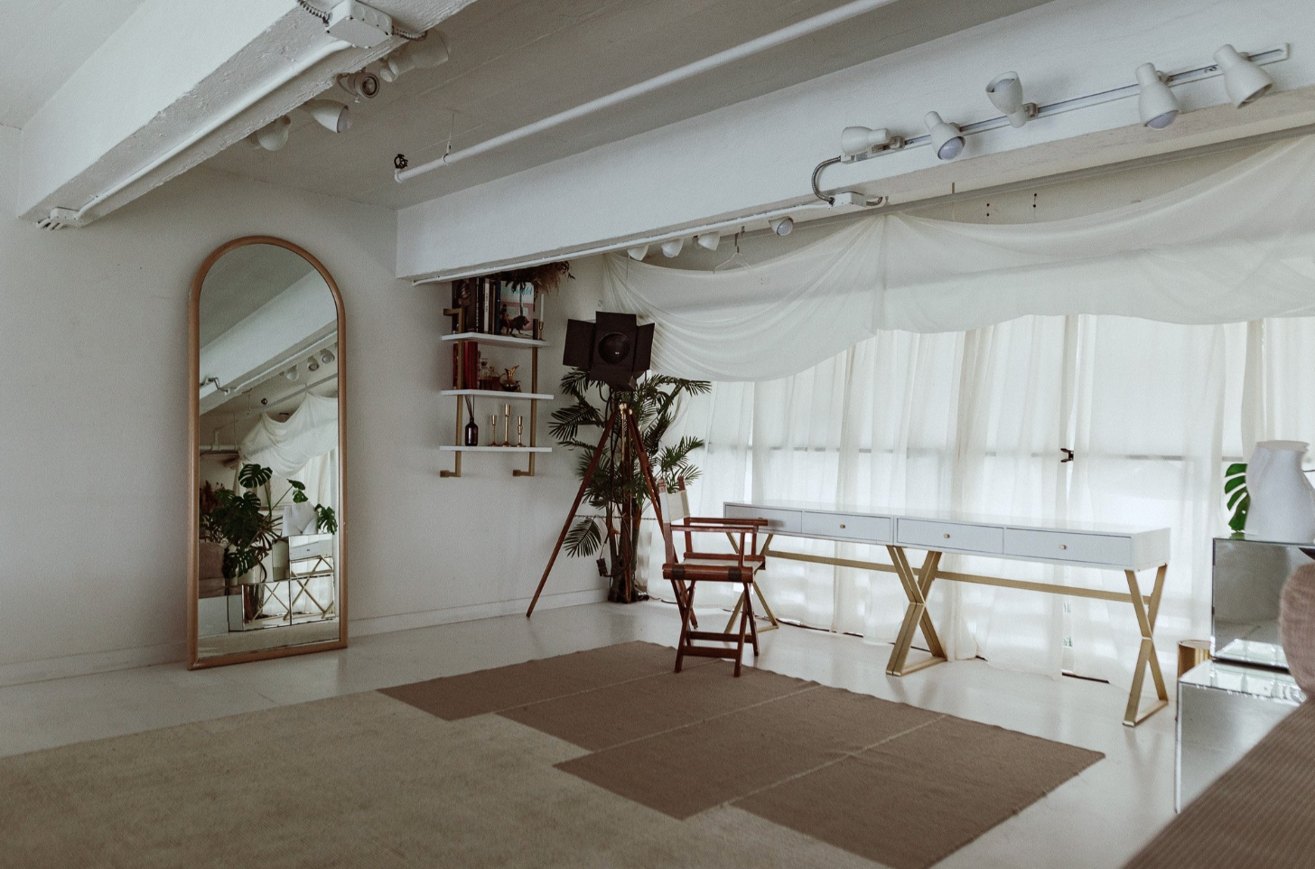 Bright white minimalist event space with high ceilings at Atmosfera in Astoria, Queens