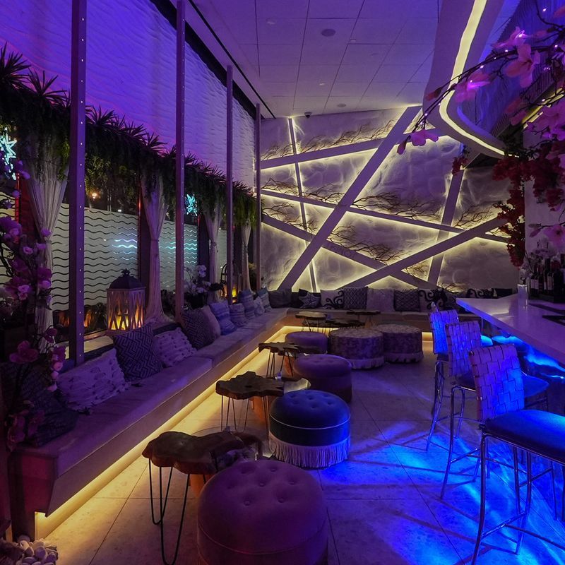 Dining room with cherry blossom installations at Skinos, a Greek restaurant and lounge in the Financial District