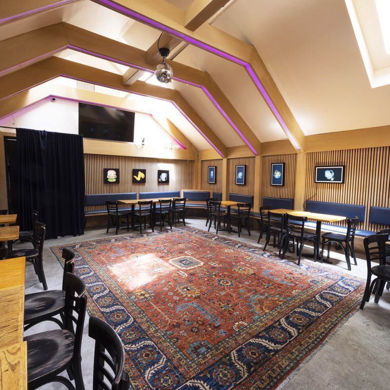 Classic dive bar interior with checkered floor at PubKey in Greenwich Village