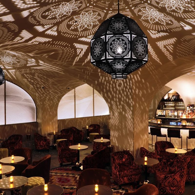 Moroccan-inspired lounge with tilework and plush seating at Célon inside the Bryant Park Hotel