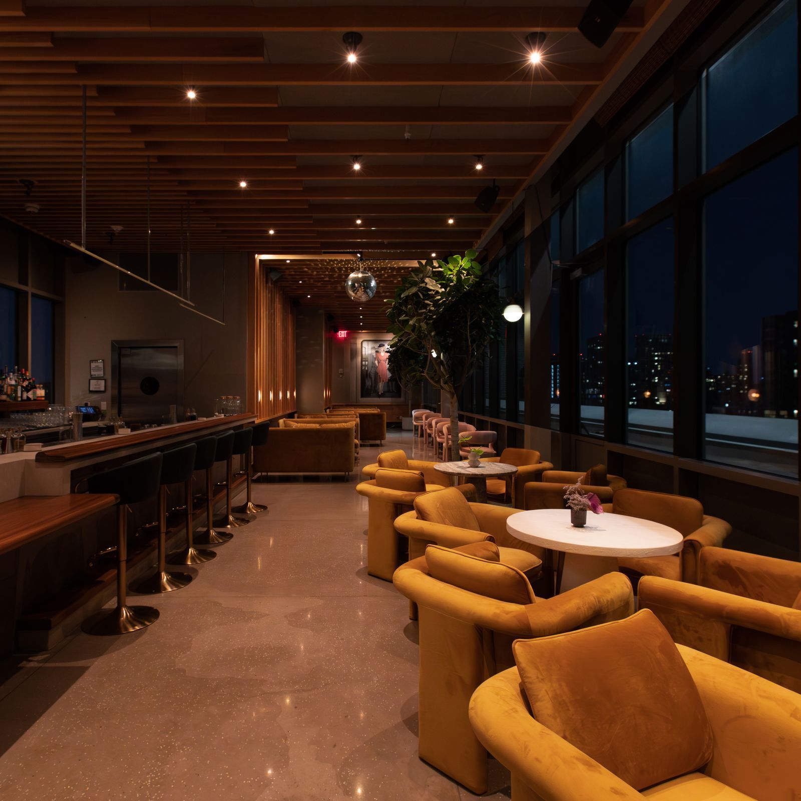 Unlisted at Untitled Hotel rooftop lounge Lower East Side NYC with downtown skyline views and rotating street art