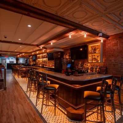 Cozy dining room and bar at BarDough on Restaurant Row in Hell's Kitchen