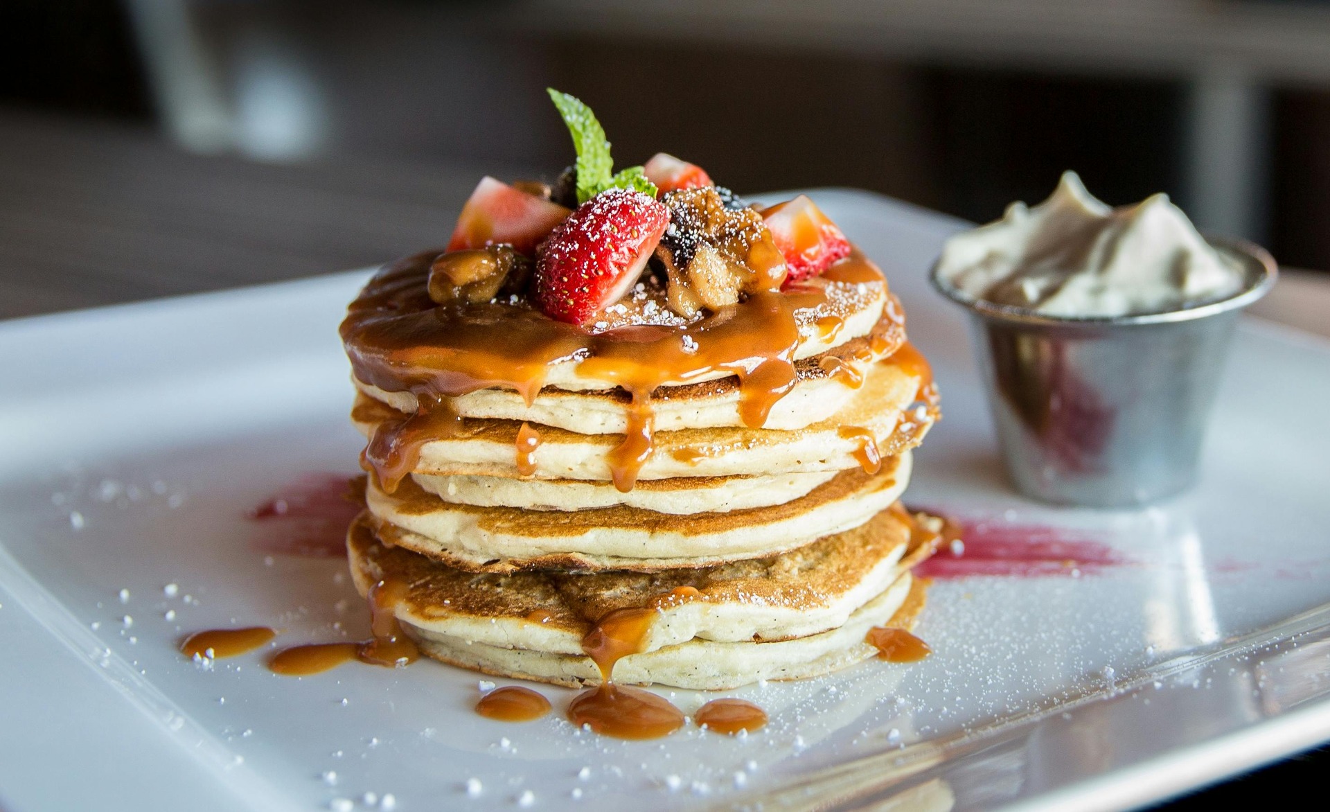 Caramel Fruit Pancake Stack with Whipped Cream on Plate