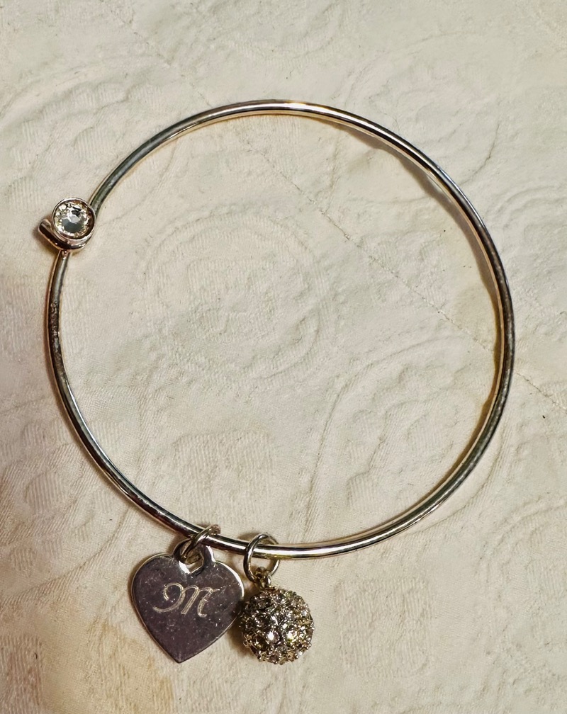 Elegant Silver-Toned Bangle Bracelet with Charms