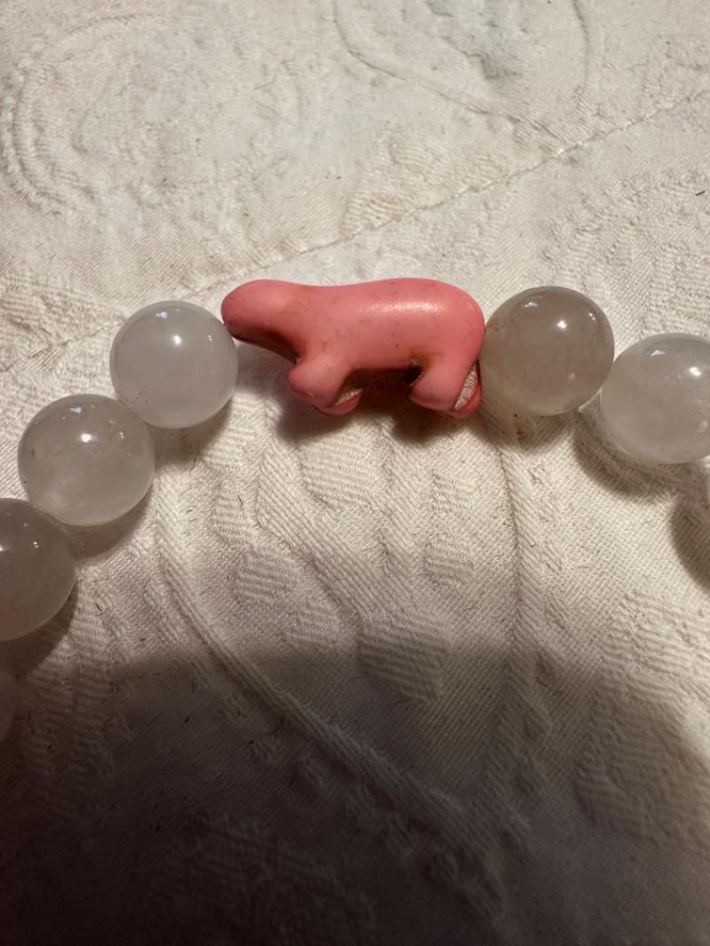 Light-Colored Beaded Bracelet with Pink Figurine