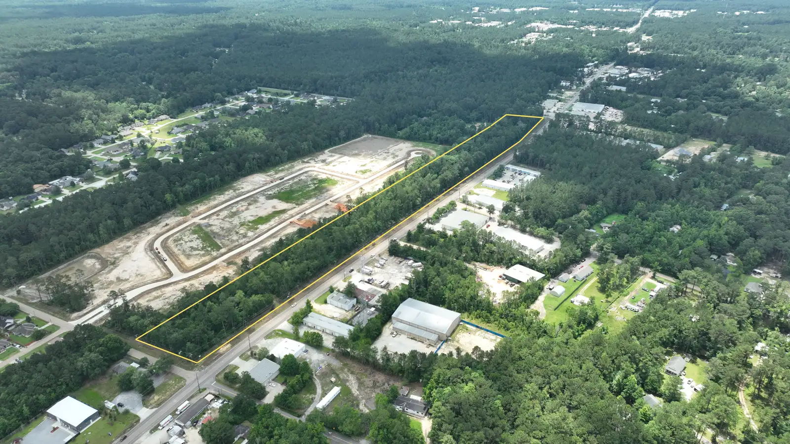 12.72 Acres with 2,600± FT of High-Visibility Hwy 59 Frontage