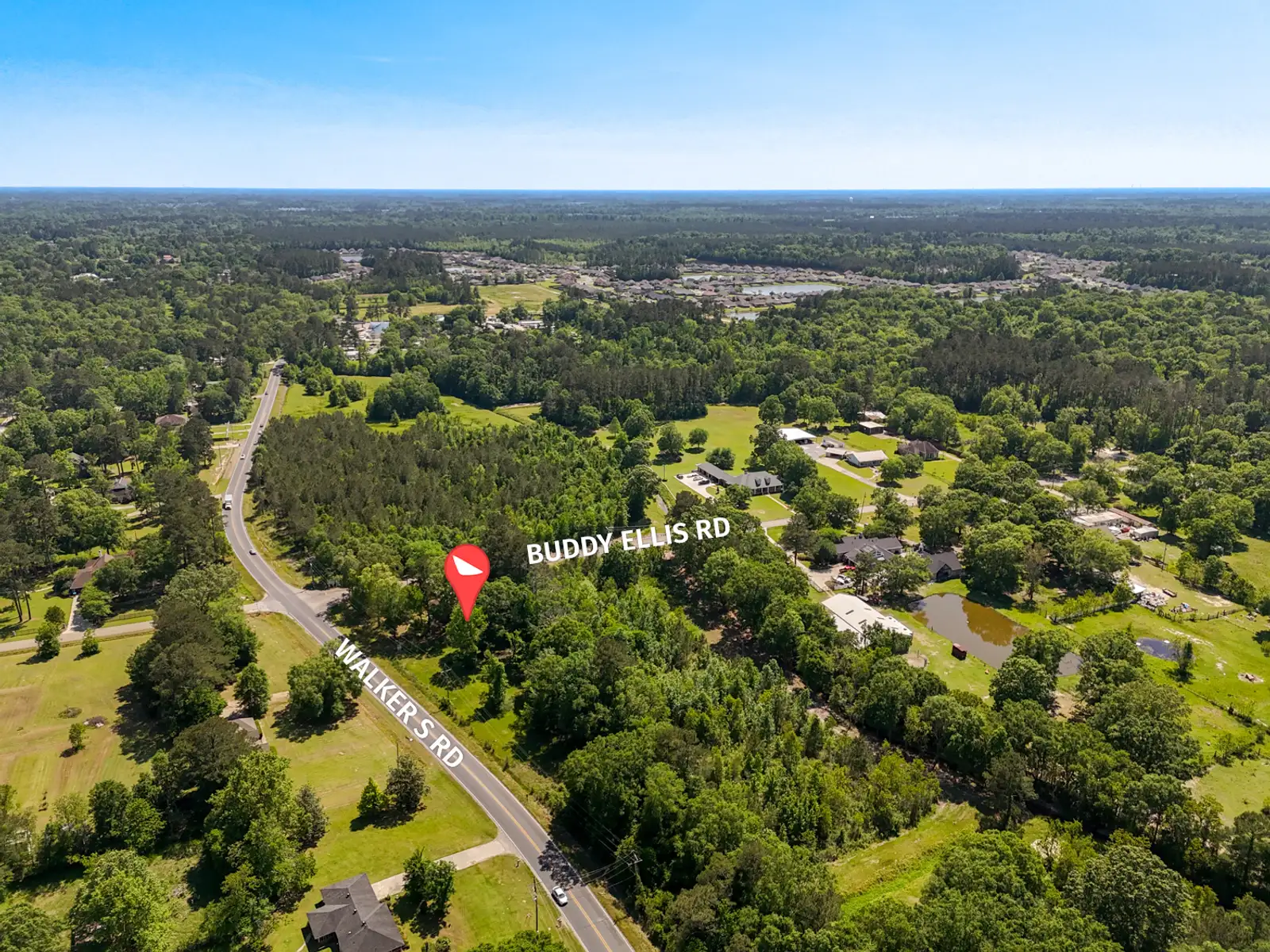 Corner Acreage with Development Potential Near I-12 image 2