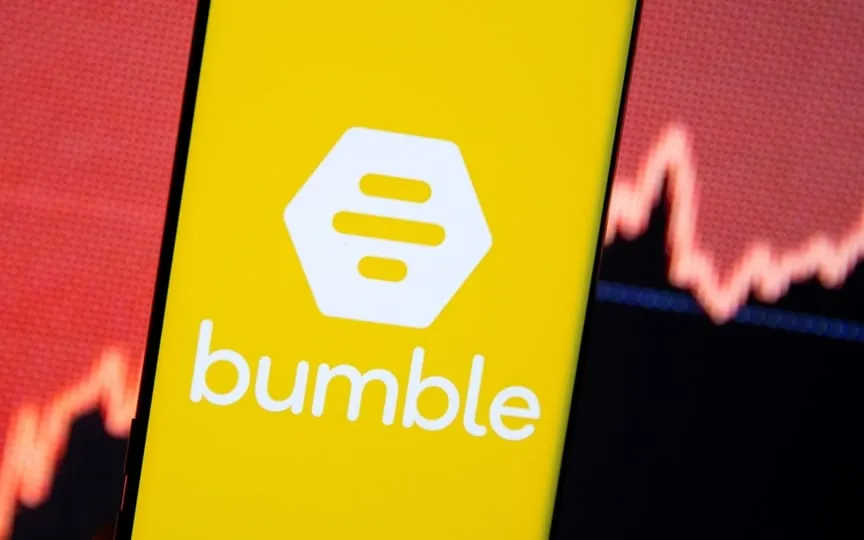 The Bumble logo is seen on a smartphone in front of a stock graph in this illustration taken February 11, 2021. (REUTERS)