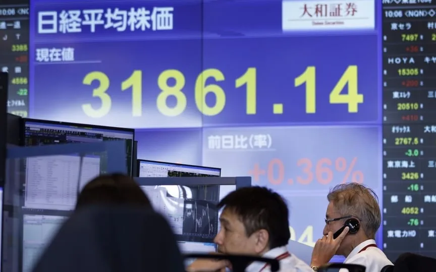 Employees work in the trading room at the Daiwa Securities Group Inc. headquarters in Tokyo, Japan. (Bloomberg)