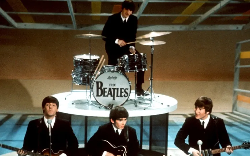 The Beatles, Paul McCartney, George Harrison, John Lennon and Ringo Starr on drums perform on the CBS "Ed Sullivan Show" in New York on Feb. 9, 1964. (AP)