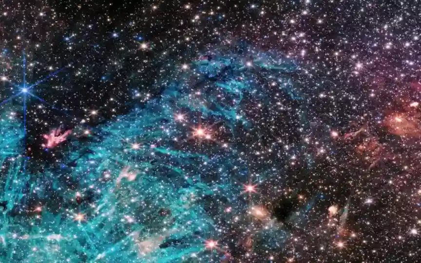 According to NASA, about 500,000 stars that are being shown in the image are a cluster of protostars. (NASA, ESA, CSA, STScI, and S. Crowe (University of Virginia).)