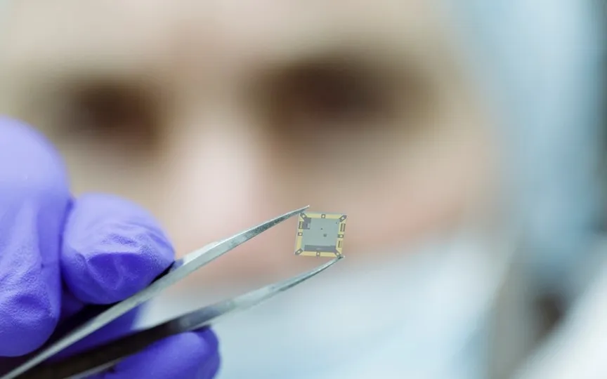 A worker poses for a photo as the SEEQC's DQM system-on-a-chip integrates critical management functions on a chip, delivering a new level of scale, speed and cost-effectiveness, and enabling new functionalities to quantum computing, (REUTERS)