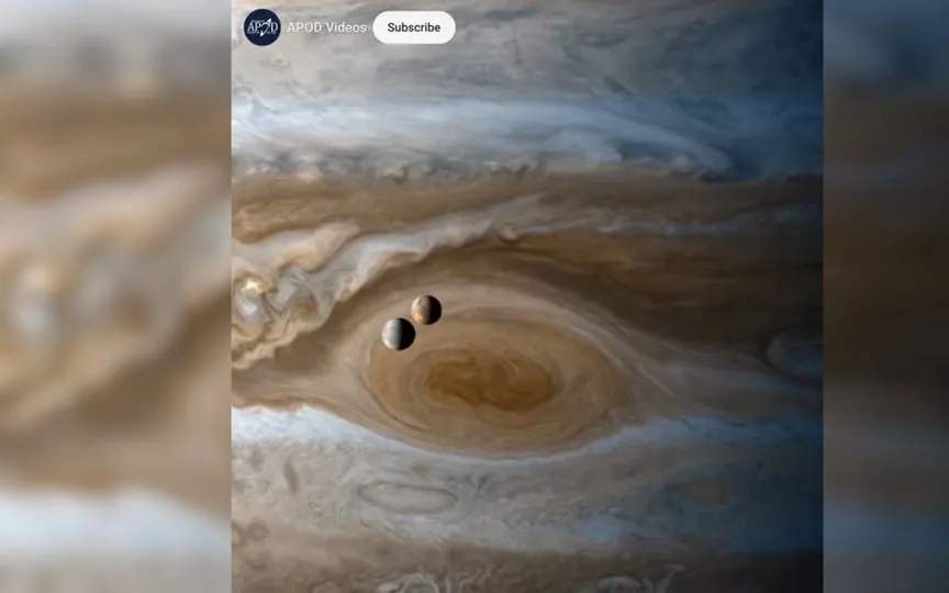 Jupiter’s two Galilean moons were snapped crossing the great red spot by NASA spacecraft. (NASA/ESA/JPL/Cassini Imaging Team/SSI)