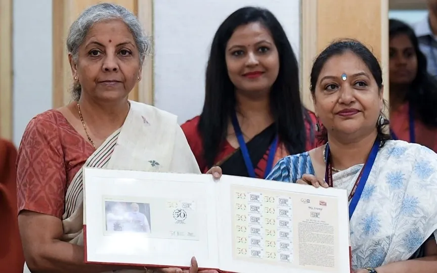 Union Finance Minister Nirmala Sitharaman releases a stamp during the 50th meeting of the GST Council, at Vigyan Bhawan in New Delhi on Tuesday. (Shrikant Singh)