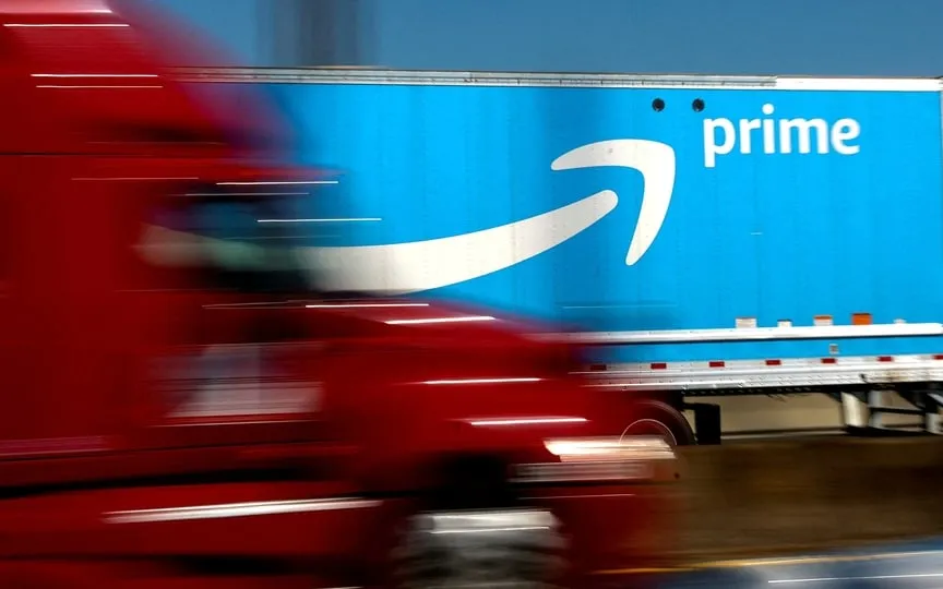 An Amazon Prime truck is pictured as it crosses the George Washington Bridge on Interstate Route 95 during Amazon's two-day "Prime Early Access Sale" shopping event for Amazon members in New York City, (REUTERS)