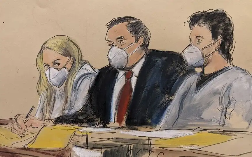 Attorney Sam Enzer, center, sits between Heather Morgan, left, and her husband, Ilya "Dutch" Lichtenstein in New York. (Bloomberg)