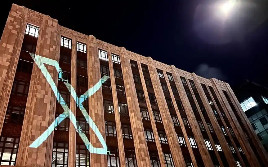 Twitter is now known as X, with CEO Linda Yaccarino sharing an image of the logo being projected on its corporate headquarters building in San Francisco. (Linda Yaccarino/X)