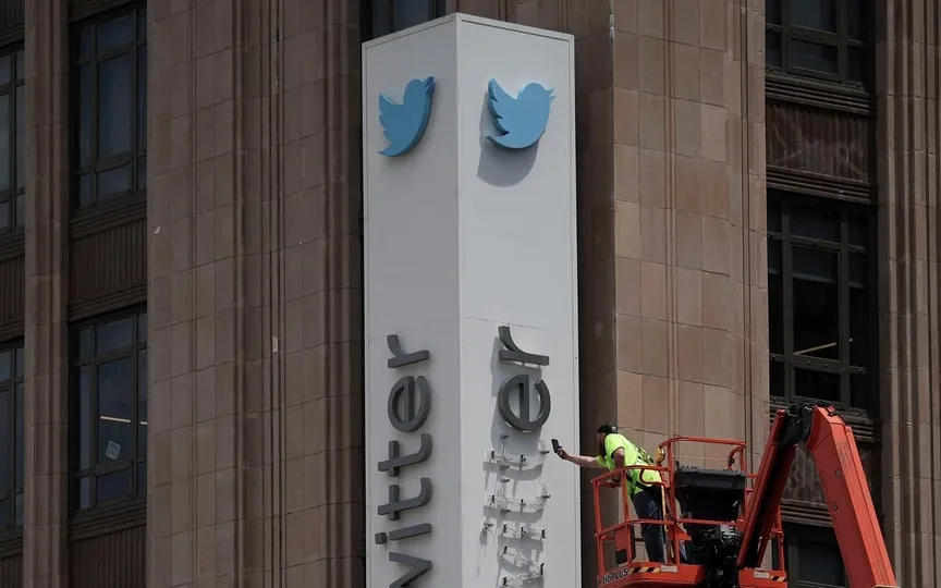 A worker dismantles at Twitter's sign at Twitter's corporate headquarters building as Elon Musk renamed Twitter as X and unveiled a new logo, in downtown San Francisco, California, U.S. (REUTERS)