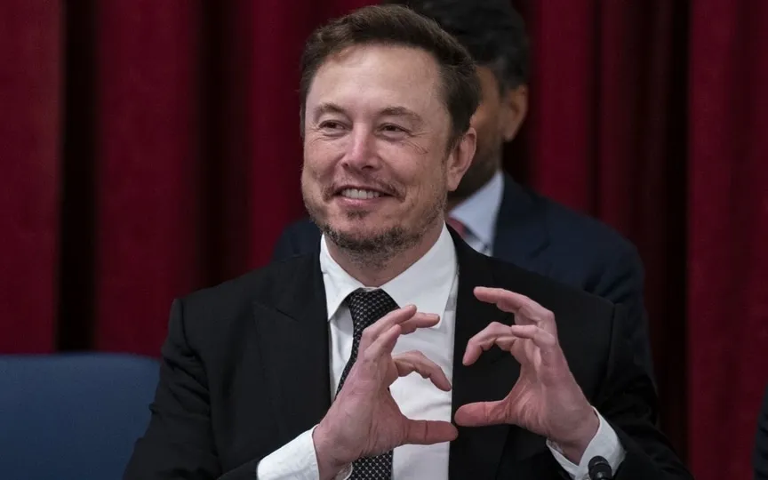 Elon Musk makes a heart with his hands during a Senate bipartisan Artificial Intelligence (AI) Insight Forum on Capitol Hill in Washington, DC, US, (Bloomberg)