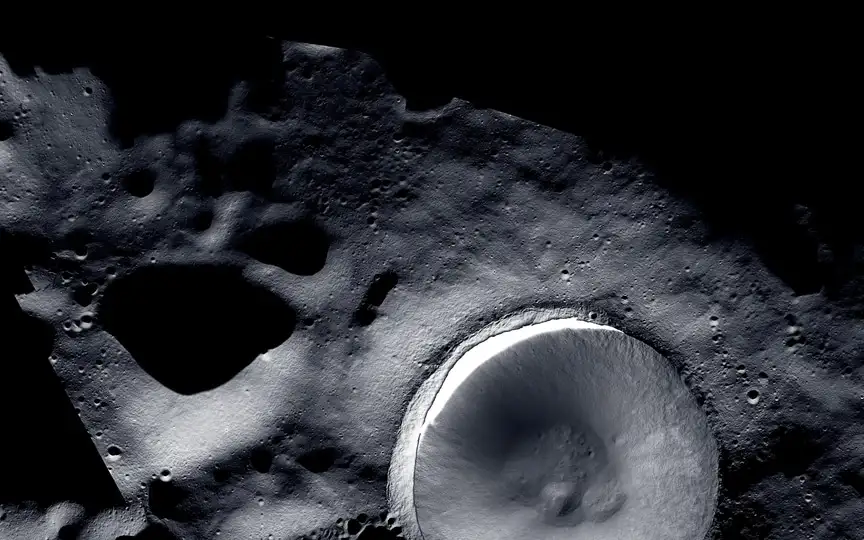 This image offers an unprecedented level of detail of the lunar South Pole region, highlighting a crater designated as Shackleton Crater. ( created by LROC (Lunar Reconnaissance Orbiter) and ShadowCam teams with images provided by NASA/KARI/ASU)