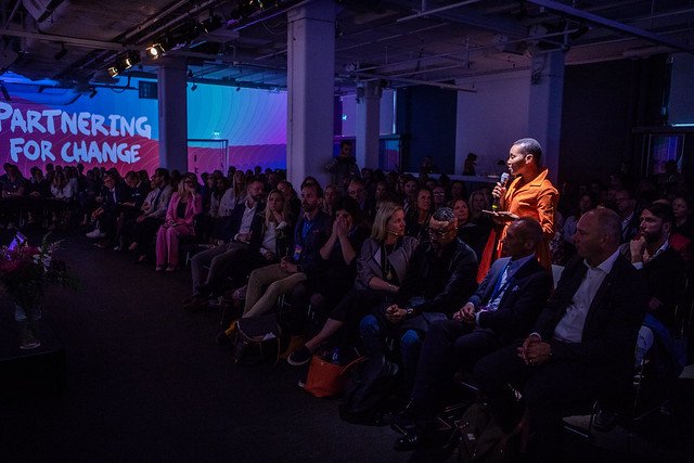 Social entrepreneur Nancy Sumary tells her story during a Partnering for Change event