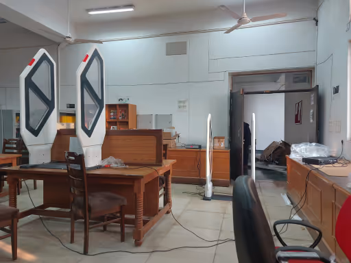 RFID EAS Gate for enhanced tracking and security Dual pedestal RFID and AM EAS anti-theft security gate deployed in commercial showroom entrance