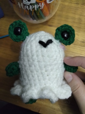 Frog in a ghost costume
