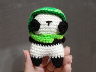 Panda bear in dinosaur cute hat