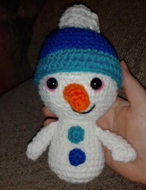 white and blue snowman plus toy free image