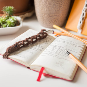 I whipped up a quick pen holder strap for my journal. : r/crochet