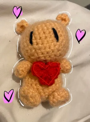 teddy holding a heart