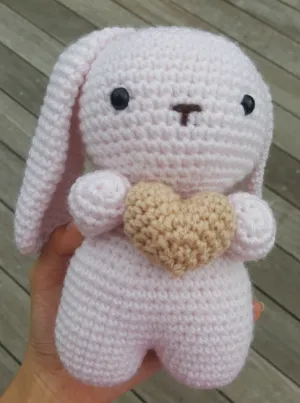 cute bunny holding a heart plushie