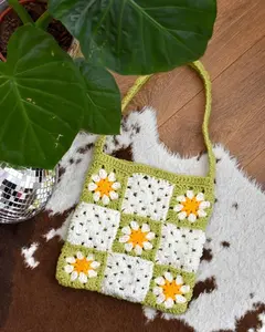 Crocheted granny squares across body bag