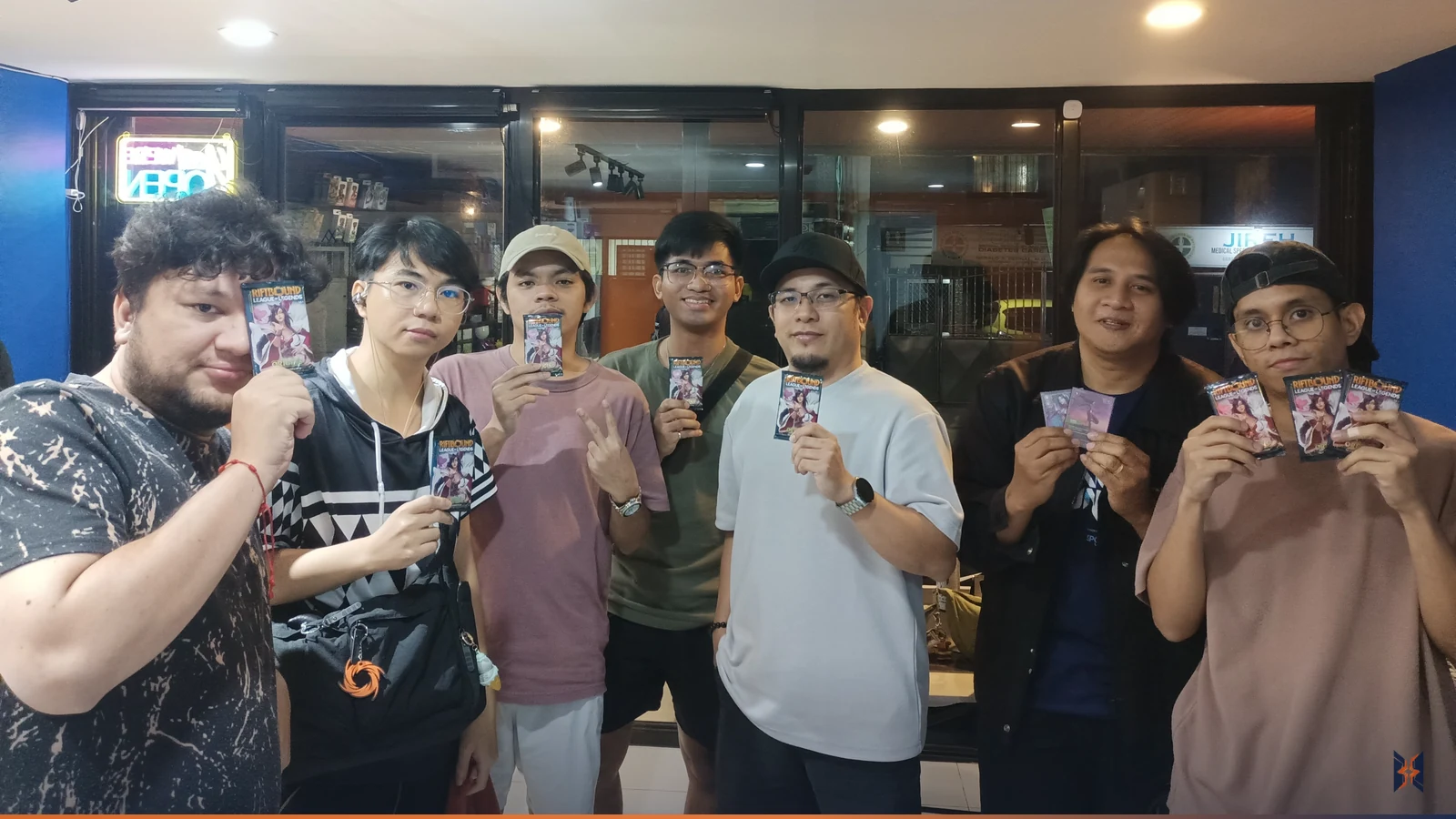 Nexus Night players holding up their prize packs at Rift Vault