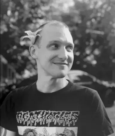 Riley with a flower behind his ear. Shot in black and white.